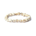 Armband Been Met 21 Schedelvormige Kralen ±1cm